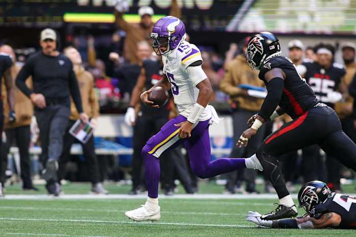 Nov 5, 2023; Atlanta, Georgia, USA; Minnesota Vikings quarterback Joshua Dobbs (15) runs the ball against the Atlanta Falcons in the second half at Mercedes-Benz Stadium.